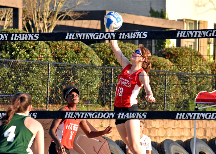 Lexie DeVuyst (#13) and Alex Hillman (#11) won a three-set match on Saturday to help the first-year Huntingdon beach volleyball team clinch its first team win. (Photo by Wesley Lyle)