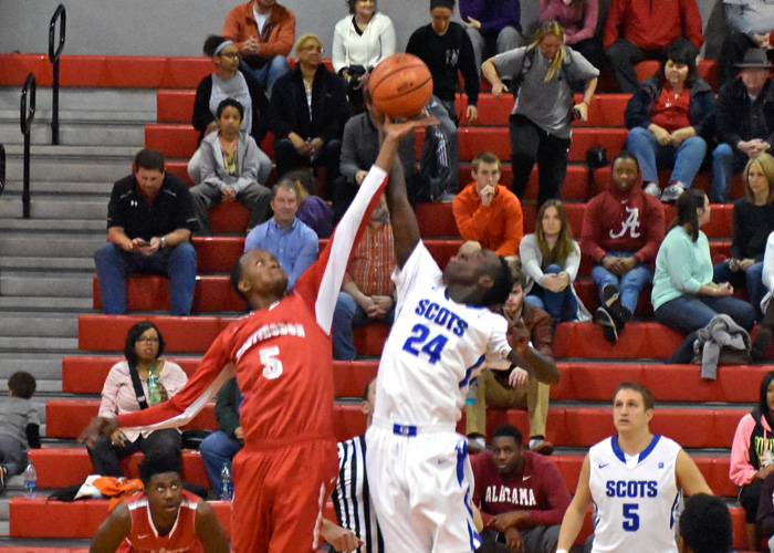 Jerrod Pettus leaps for the opening tipoff in Saturday's game with Covenant.