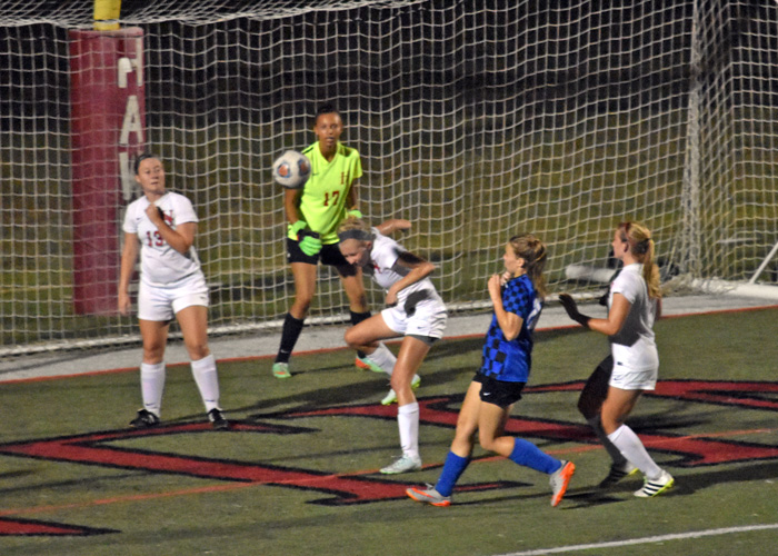 Kira Bohlke heads a Covenant shot away from the goal in Friday night's 1-0 loss to the USA South West Division leaders.