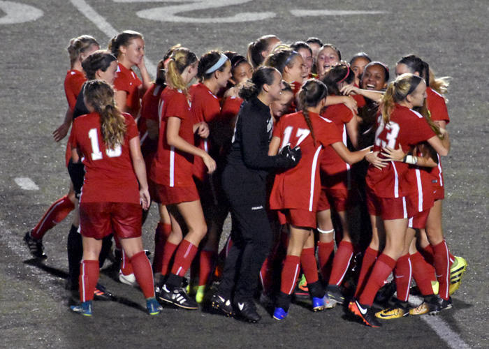 The Huntingdon women's soccer team celebrates after Camryn Hale's game-winning goal in overtime on Saturday night.