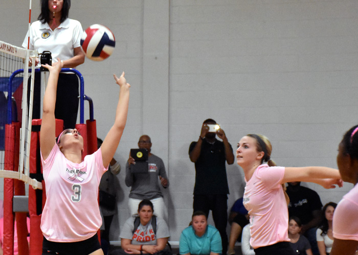 Lexi Rangel (#3) sets the ball as Ashley Childs prepares for one of her career-high 15 kills in Thursday's win over Pensacola Christian. Rangel finished with 29 assists. (Photo by Wesley Lyle)