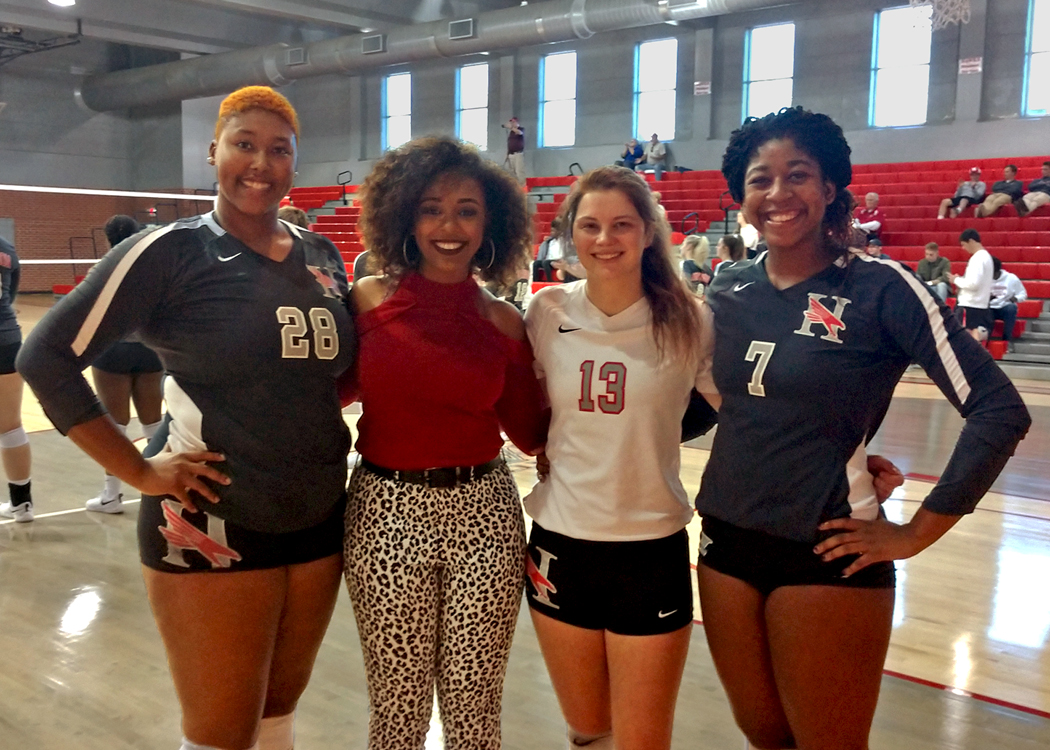 The Huntingdon volleyball team recognized (L-R) Taylor Wright (#28), Noah Harrison, Lexie DeVuyst (#13) and April Reese (#7) during Saturday's Senior Day.