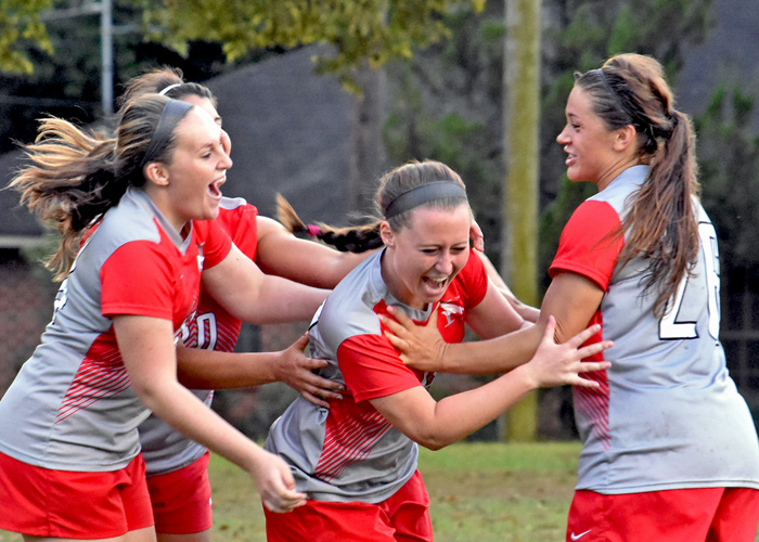 Freshman Alex Ellison (center) is congratulated by her teammates after scoring her first collegiate goal in Wednesday's 4-1 win over LaGrange.