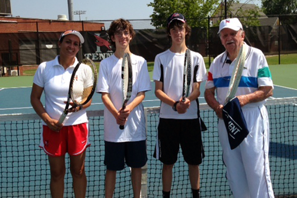 After 19 months away from the tennis courts due to health issues, John McWilliams, U.S.P.T.A., recently joined Huntingdon women’s tennis coach Ximena Moore in giving a lesson to the Ramsey twins, Hawthorne and J.B.