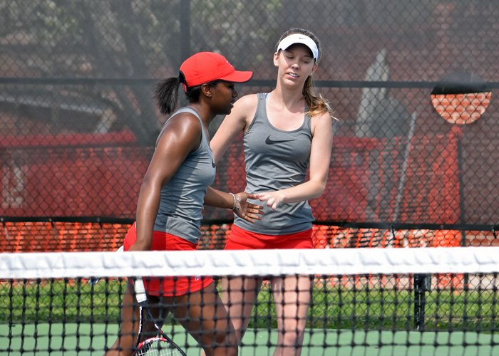 Zoya Robinson (left) and Caroline McBroom celebrate a point during their win at No. 2 doubles on Saturday.